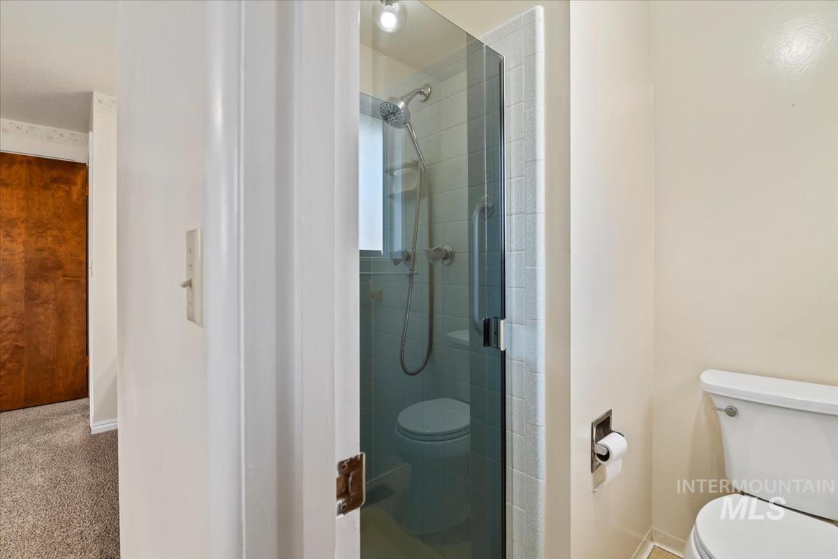 3850 Rugby Drive Boise, ID 83704 - Photo 26 of 44 Bathroom with a shower stall and carpet flooring