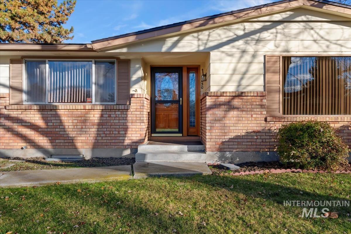 3850 Rugby Drive Boise, ID 83704 - Photo 4 of 44 Entrance to property featuring brick siding and a yard