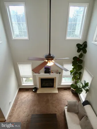 a bathroom with a sink a toilet and window