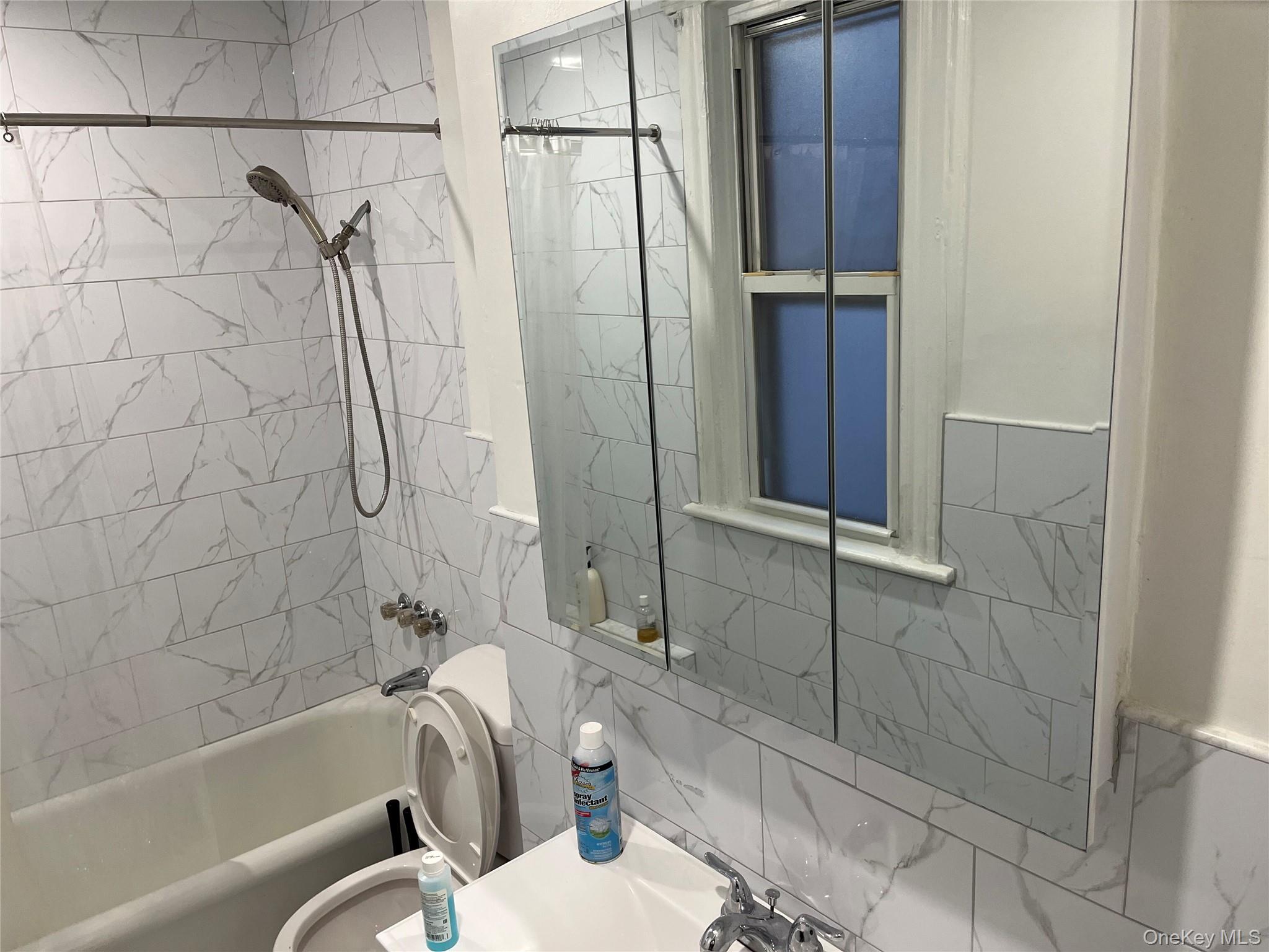 95-29 112th Street, Unit 2 Queens, NY 11419 - Photo 10 of 10 Full bath featuring shower / washtub combination and vanity