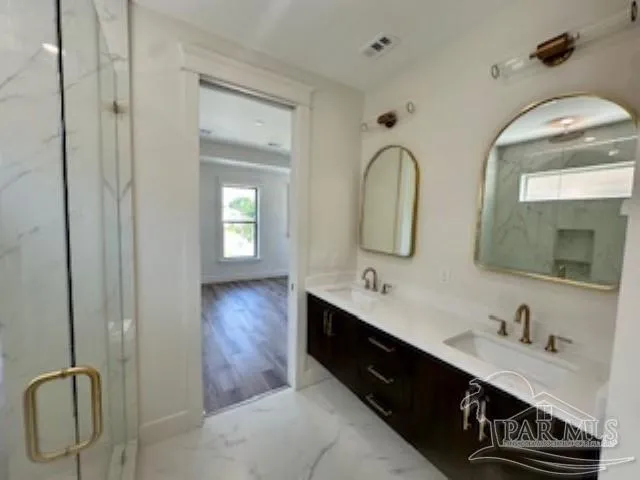 a view of a room with wooden floor and windows