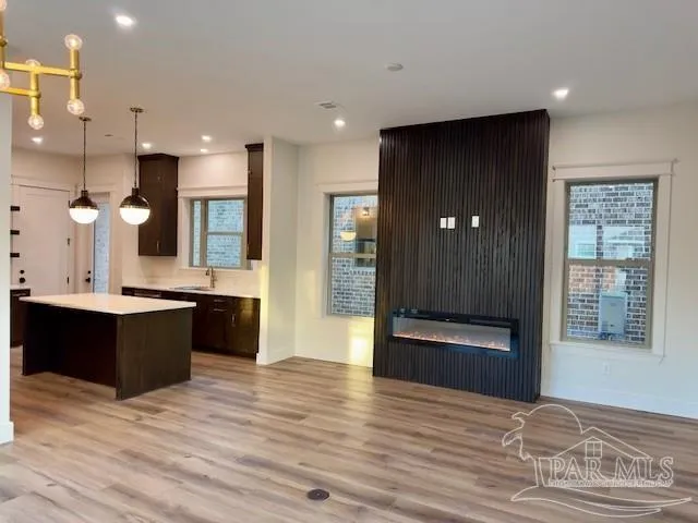a kitchen with a stove a sink and a refrigerator