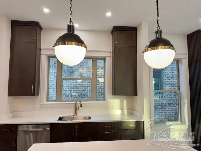 a kitchen with a sink and cabinets