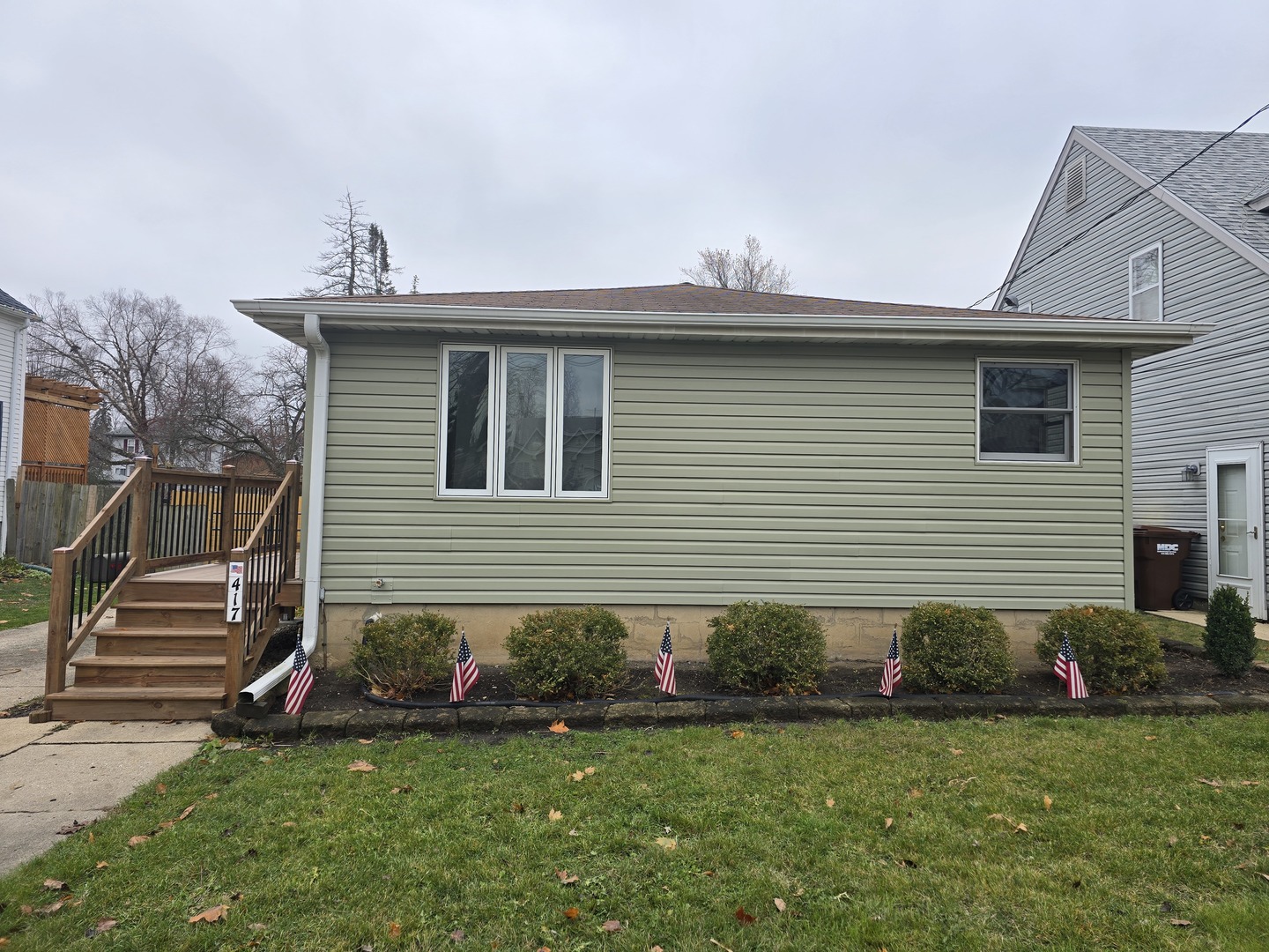 a front view of a house with a garden