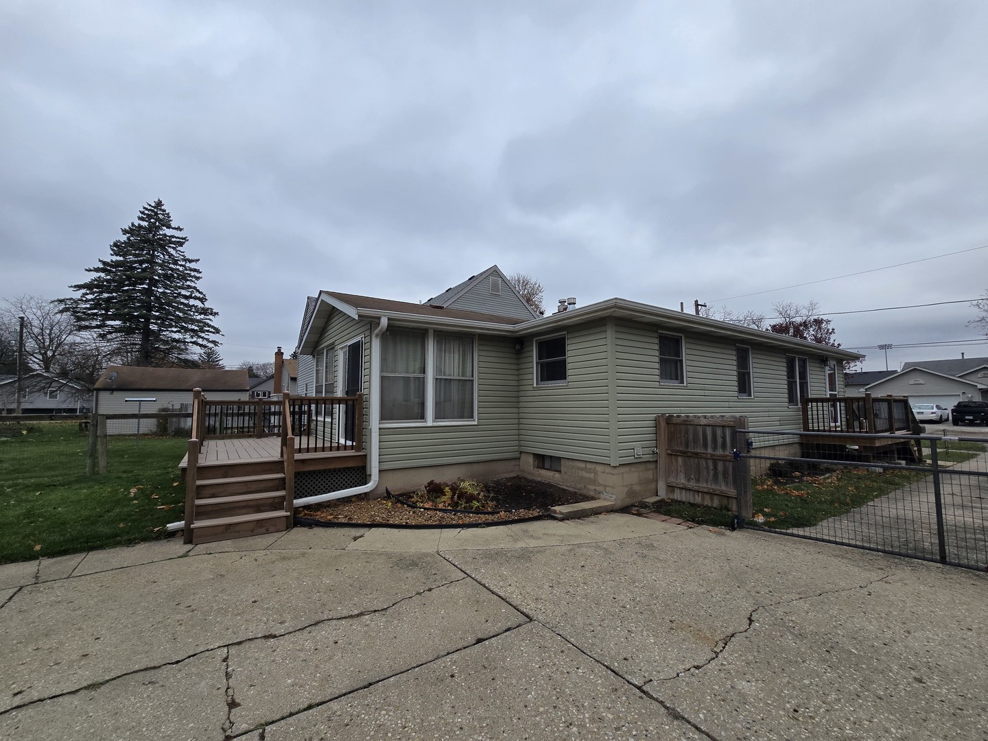 417 Stewart Avenue Woodstock, IL 60098 - Photo 2 of 22 a view of a house with a yard