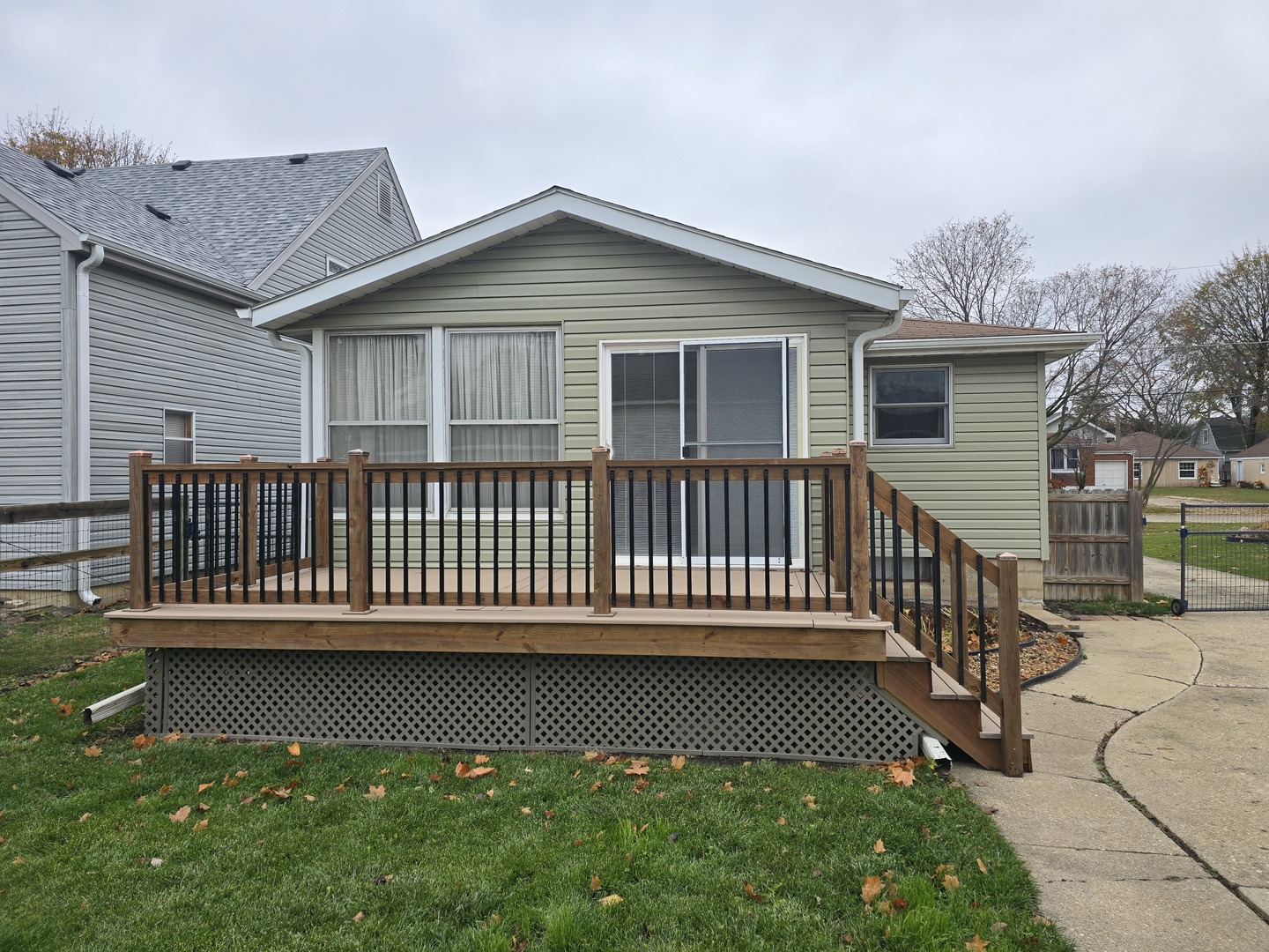 417 Stewart Avenue Woodstock, IL 60098 - Photo 3 of 22 a view of a house with a deck