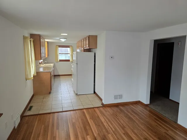 a view of a kitchen from the hallway