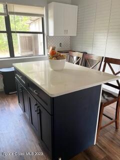 1450 Loring Street Cocoa, FL 32922 - Photo 2 of 16 a kitchen with a sink cabinets and a window