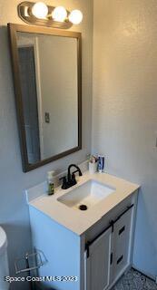 1450 Loring Street Cocoa, FL 32922 - Photo 6 of 16 a bathroom with a sink and a mirror