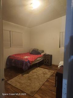 1450 Loring Street Cocoa, FL 32922 - Photo 8 of 16 a bedroom with a bed and a cabinets