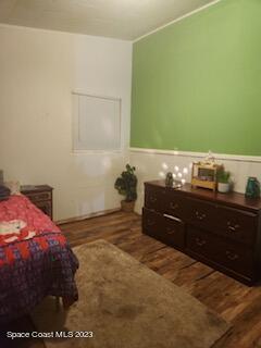 1450 Loring Street Cocoa, FL 32922 - Photo 10 of 16 a bedroom with a bed and a dresser