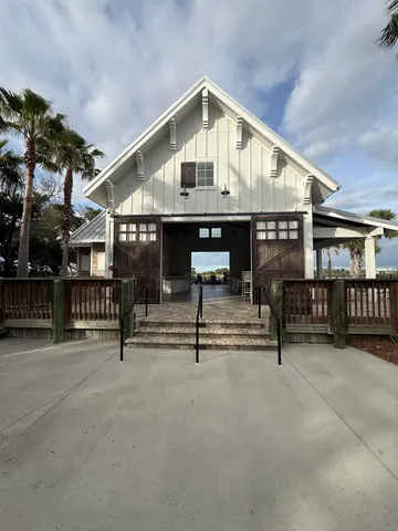 a view of house with wooden floor and a bench