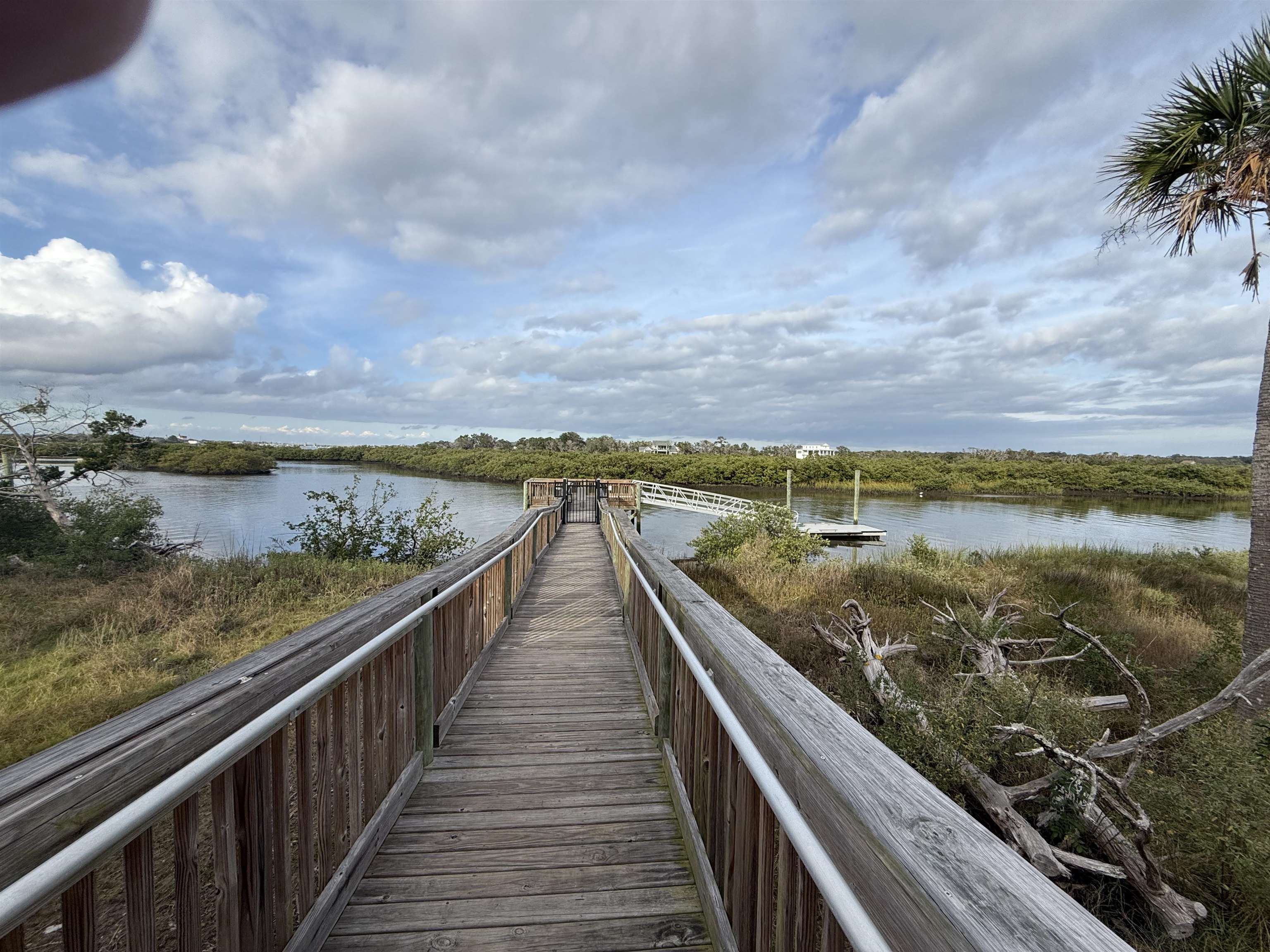209 Leeward Island Drive St. Augustine, FL 32080 - Photo 18 of 22 a view of a balcony next to a lake