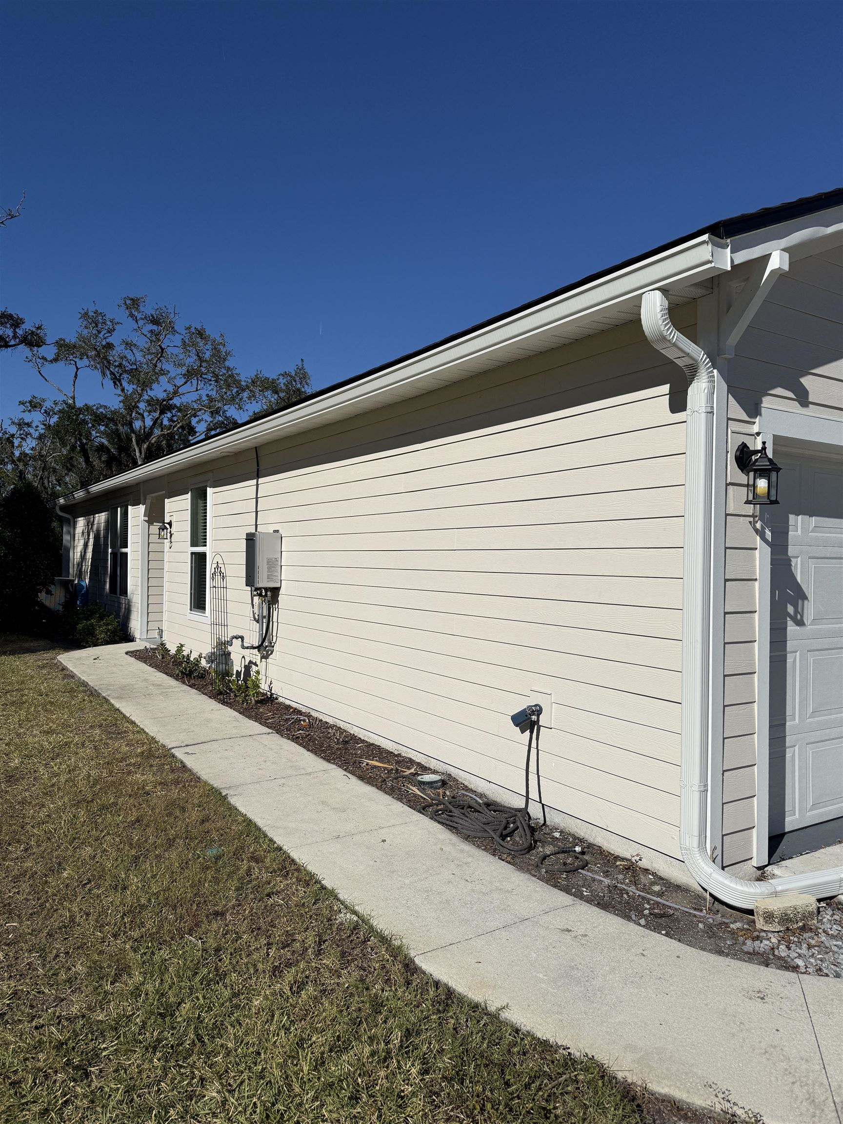 209 Leeward Island Drive St. Augustine, FL 32080 - Photo 21 of 22 a view of a house with a backyard