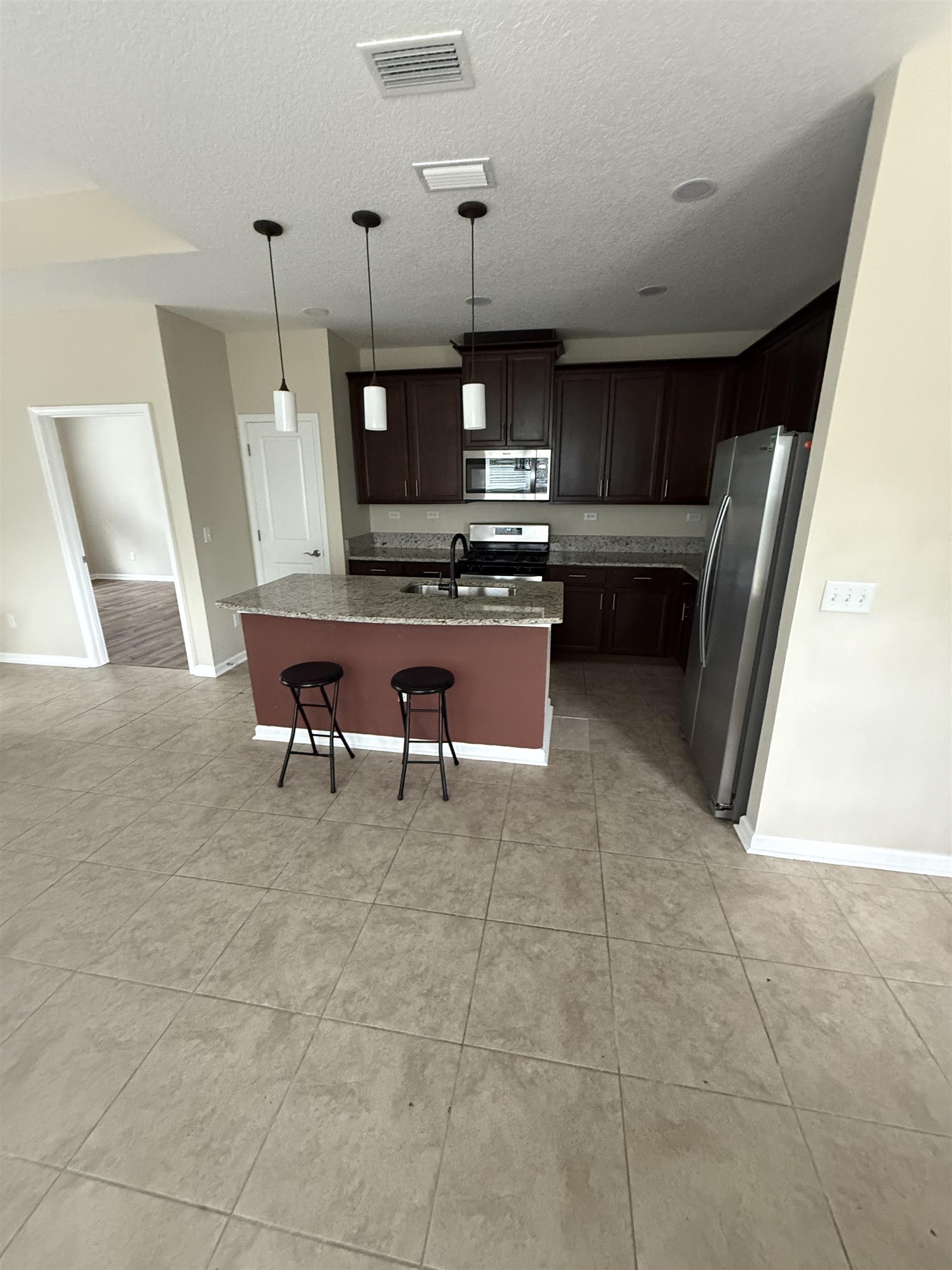 209 Leeward Island Drive St. Augustine, FL 32080 - Photo 3 of 22 a room with furniture and a flat screen tv