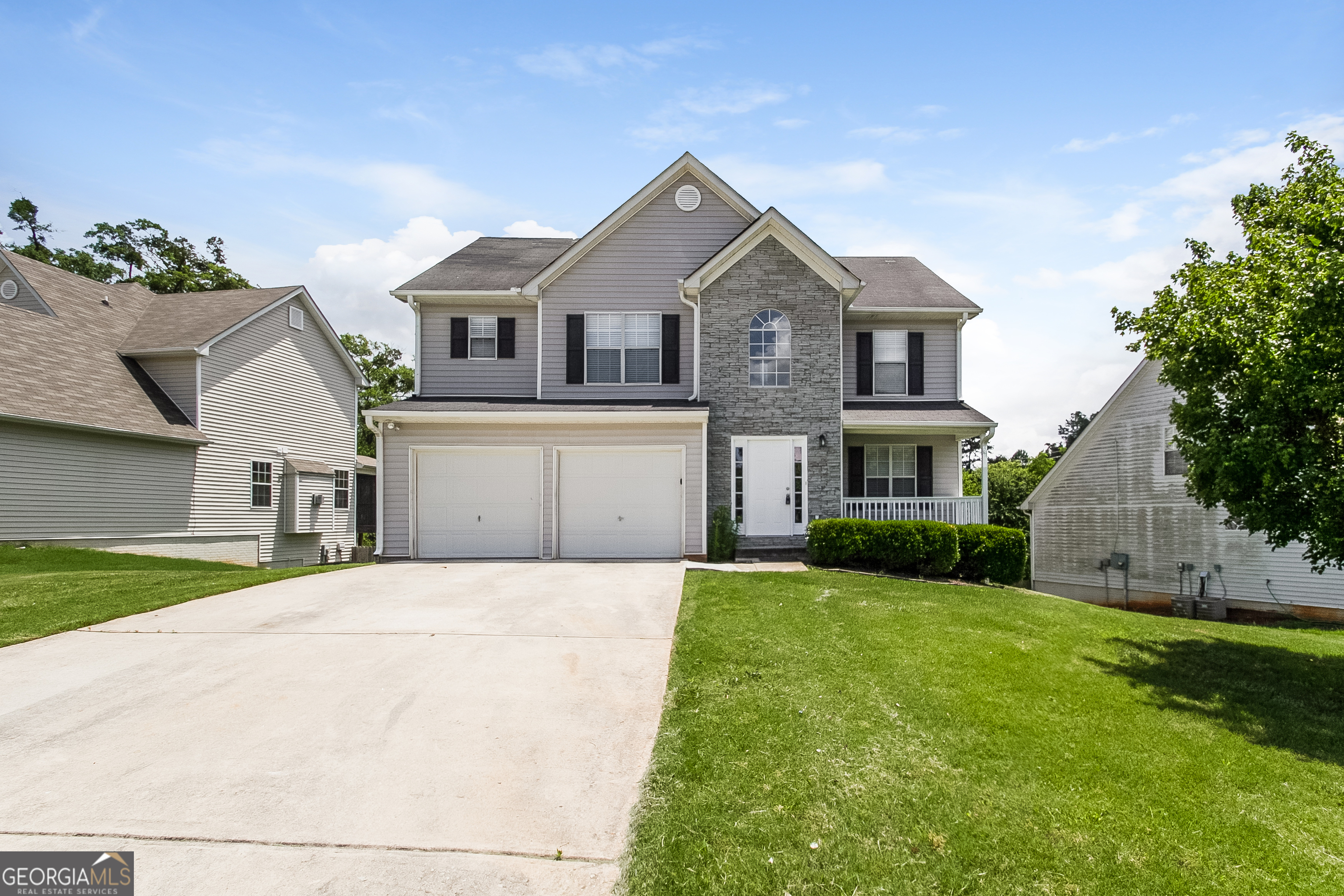 5934 Colonnade Drive Rex, GA 30273 - Photo 1 of 1 a front view of a house with a yard and garage