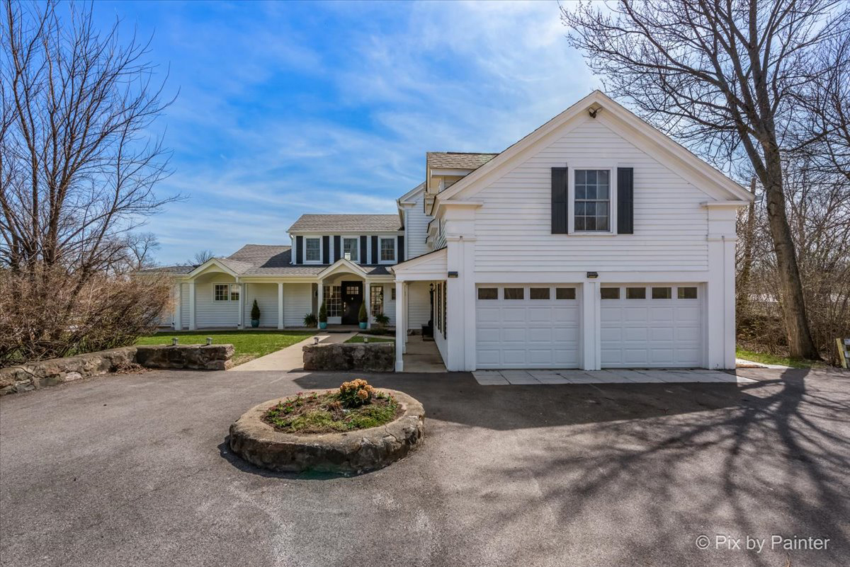 708 South Rose Farm Road Woodstock, IL 60098 - Photo 12 of 79 a front view of a house with a yard