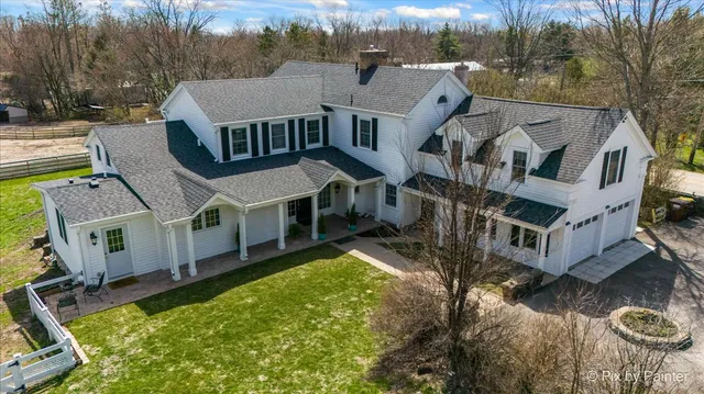 a aerial view of a house with a yard