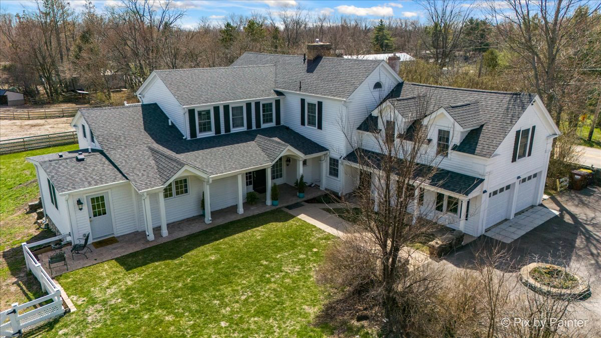708 South Rose Farm Road Woodstock, IL 60098 - Photo 3 of 79 a aerial view of a house with a yard
