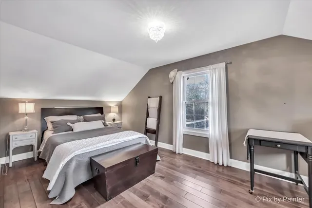aerial view of a house with swimming pool and mountains