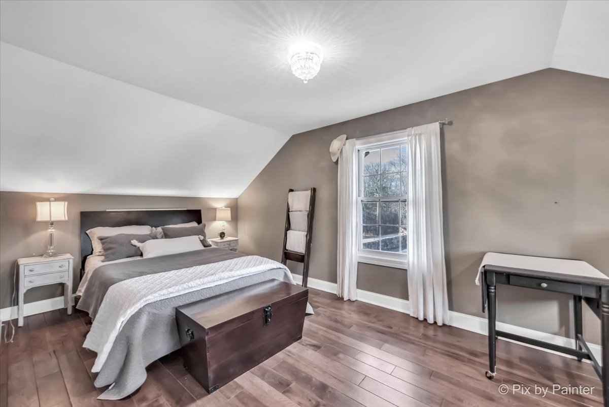 708 South Rose Farm Road Woodstock, IL 60098 - Photo 42 of 79 a bedroom with a bed and a window