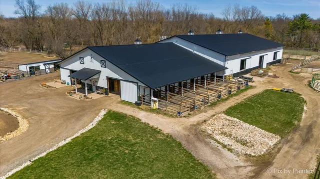 an aerial view of house with yard
