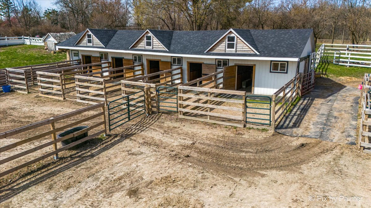 708 South Rose Farm Road Woodstock, IL 60098 - Photo 61 of 79 an aerial view of a house with a yard