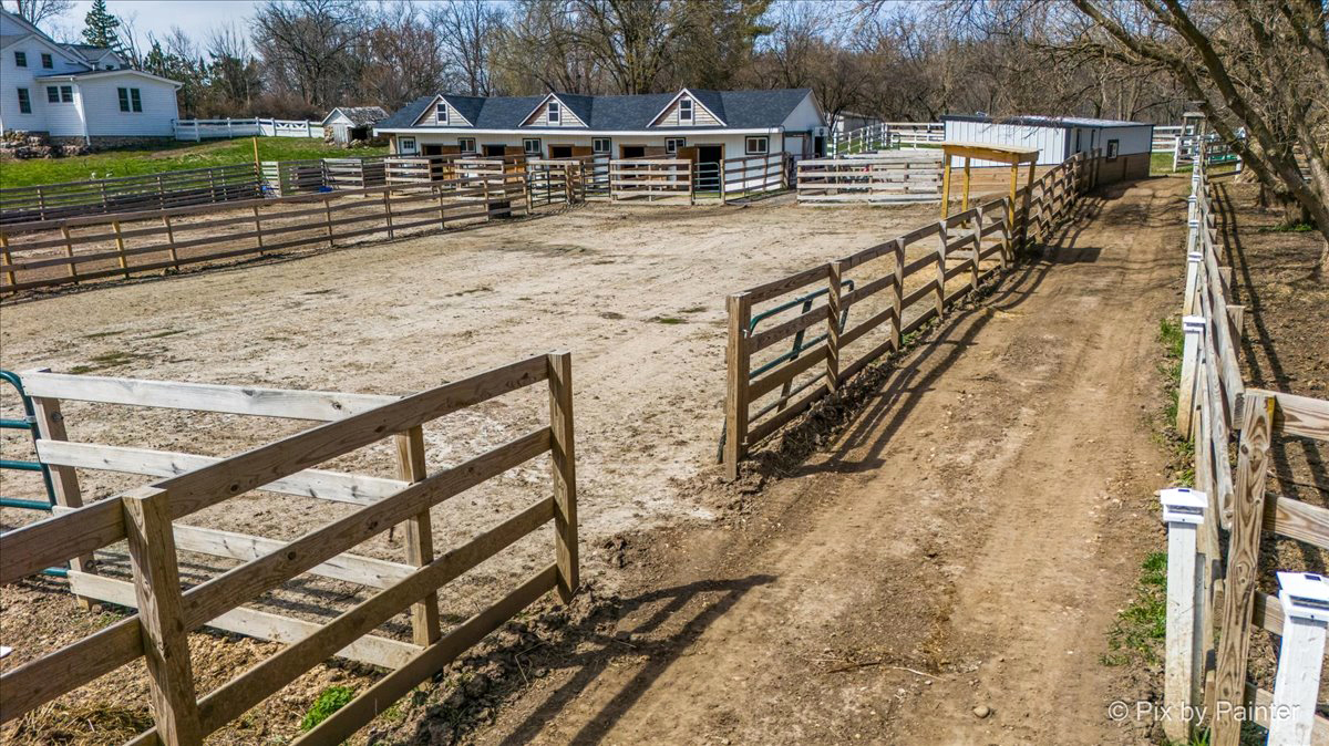 708 South Rose Farm Road Woodstock, IL 60098 - Photo 73 of 79 a view of a backyard with wooden fence