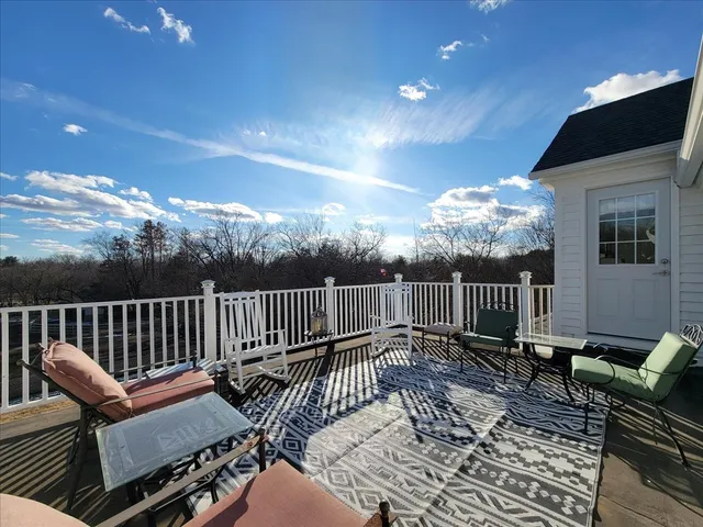 a view of a house with a yard covered with snow in the background