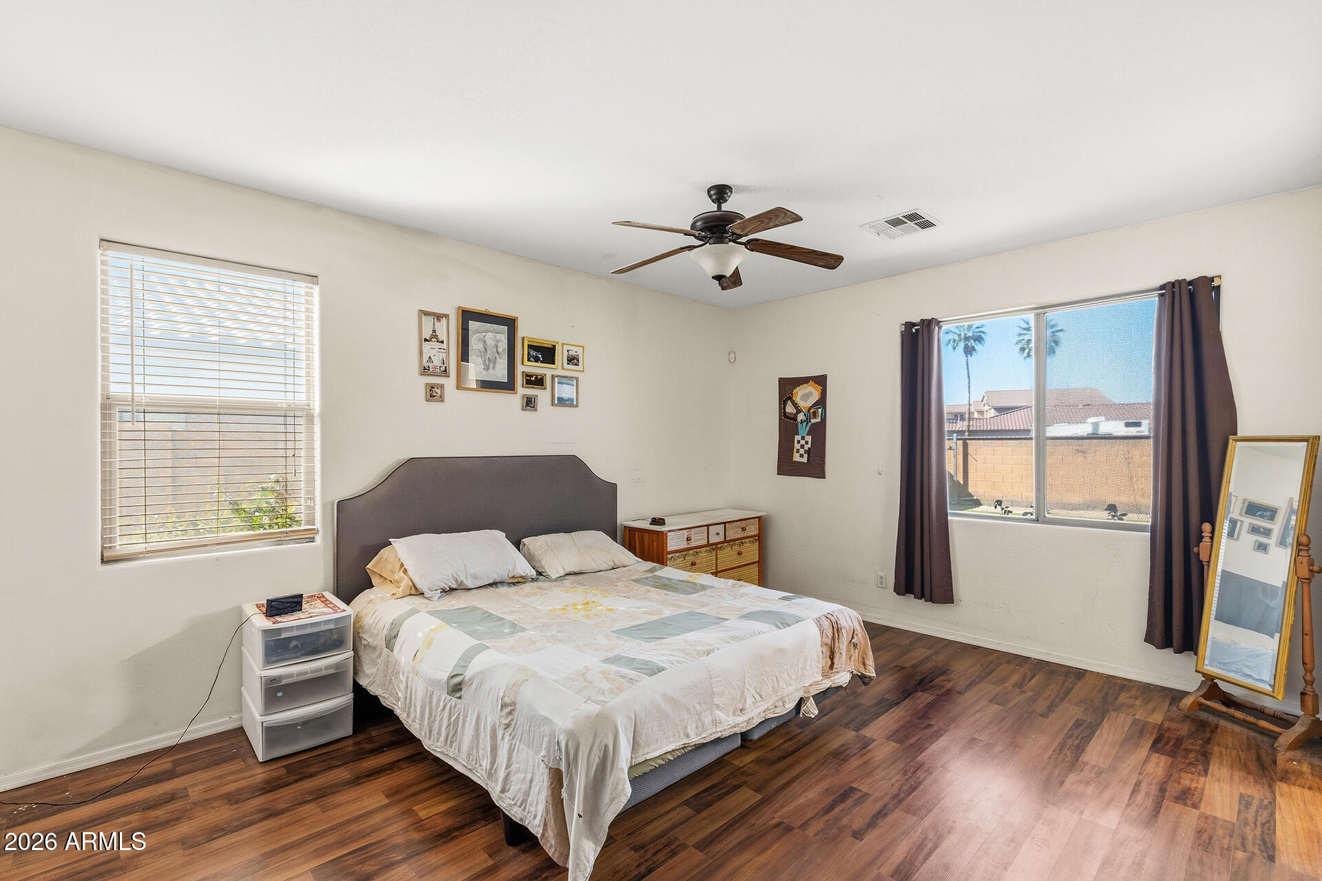 6718 West Darrel Road Laveen, AZ 85339 - Photo 13 of 49 a bedroom with a large bed and a window
