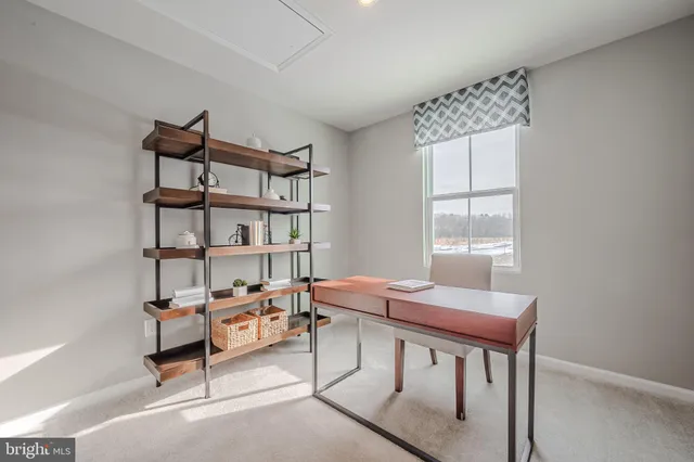 a reading room with furniture and a window