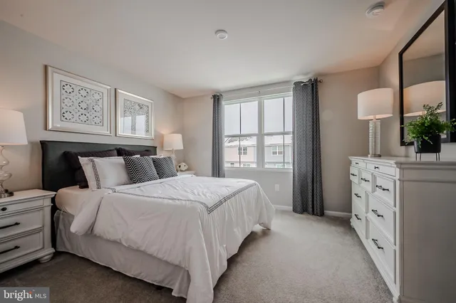 a bedroom with a bed and a television