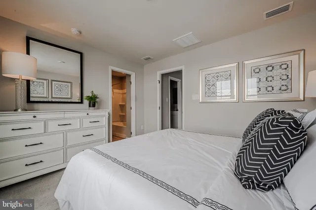 a bathroom with a toilet sink and vanity