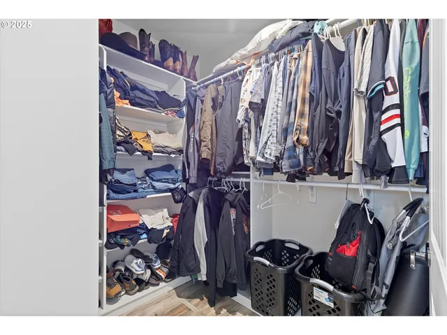 a bedroom with a bed and with view of balcony