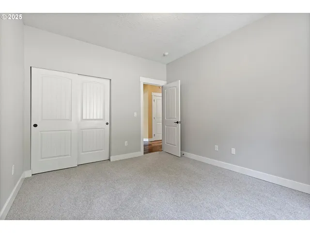 a bathroom with a sink toilet a mirror and shower