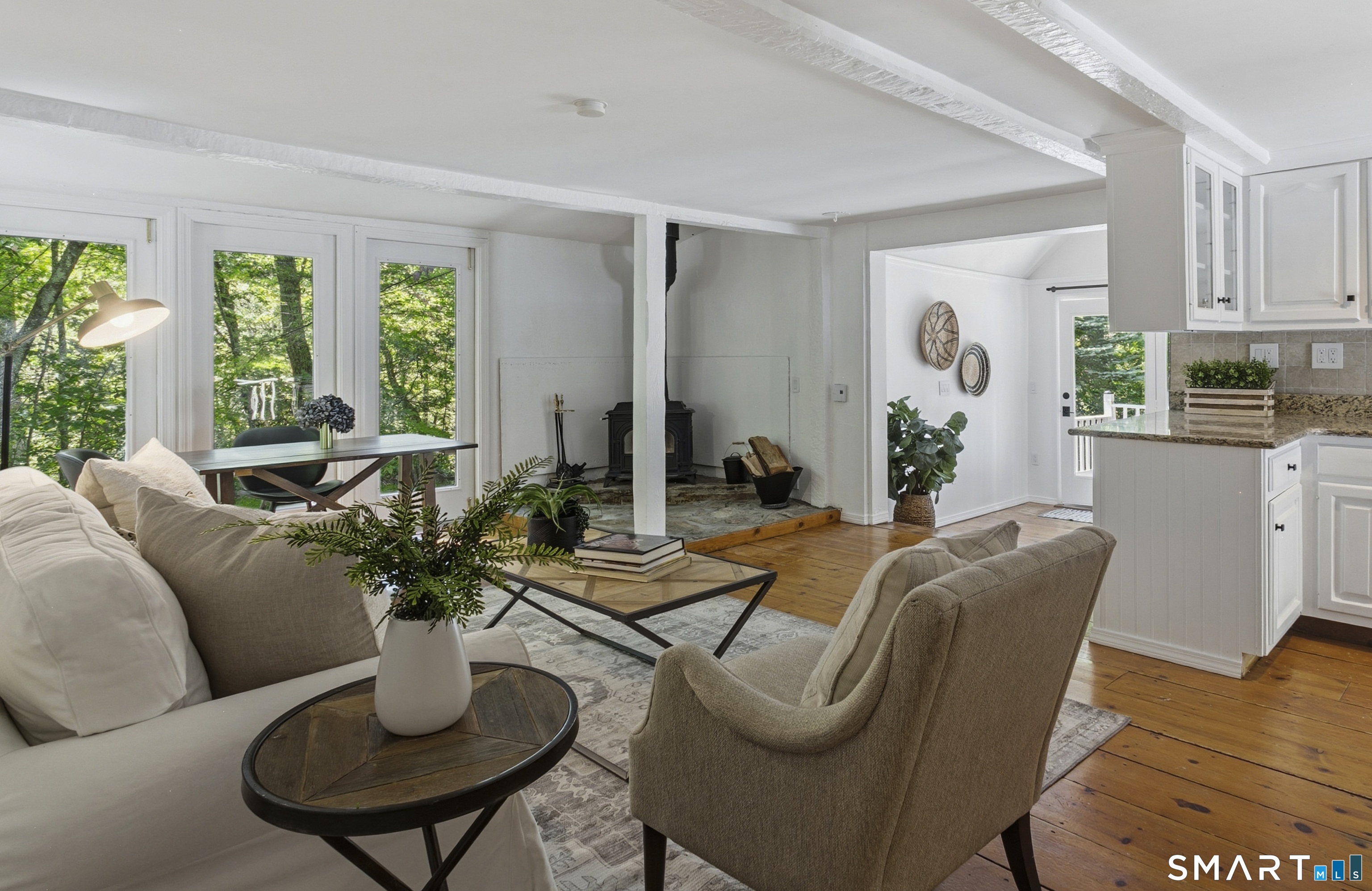 188 Bacon Road Roxbury, CT 06783 - Photo 6 of 33 a living room with furniture potted plant and a window