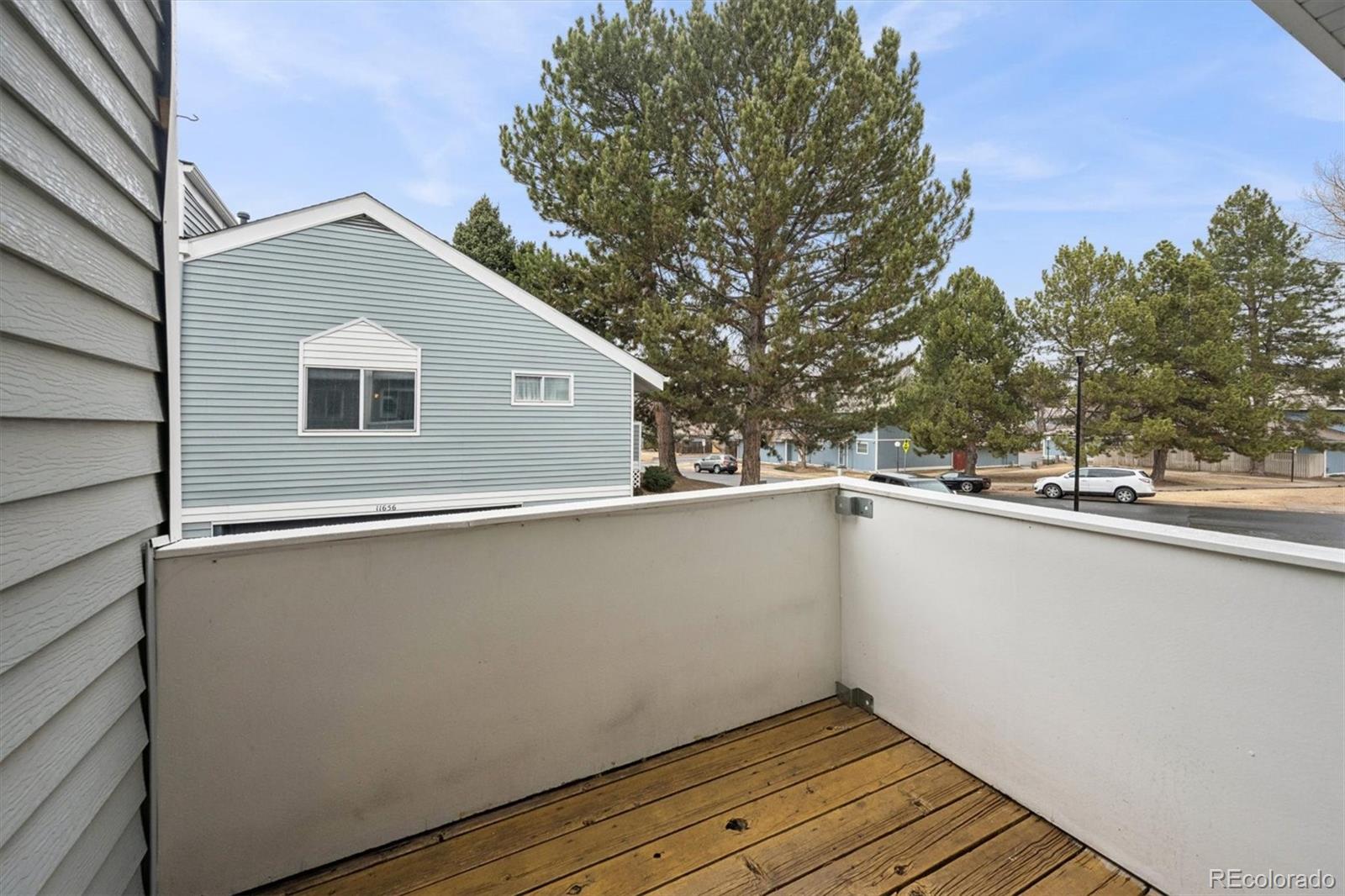 11688 East Cedar Avenue Aurora, CO 80012 - Photo 19 of 24 a view of a house with a roof deck