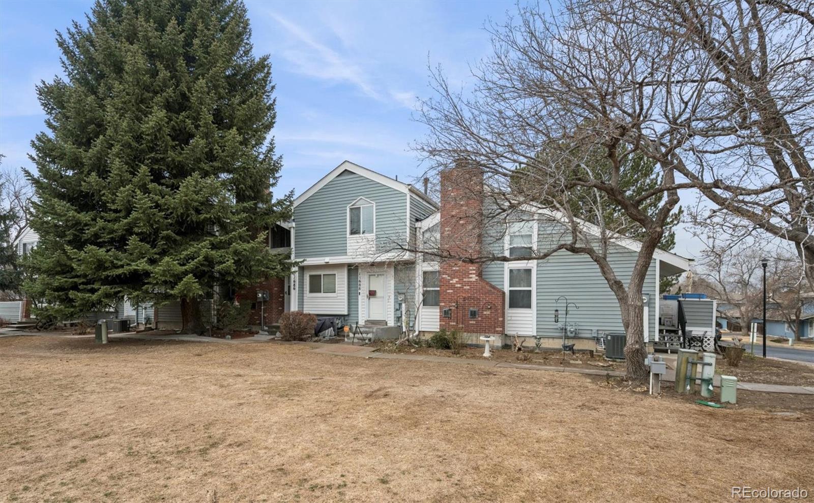 11688 East Cedar Avenue Aurora, CO 80012 - Photo 20 of 24 a view of a house with a yard