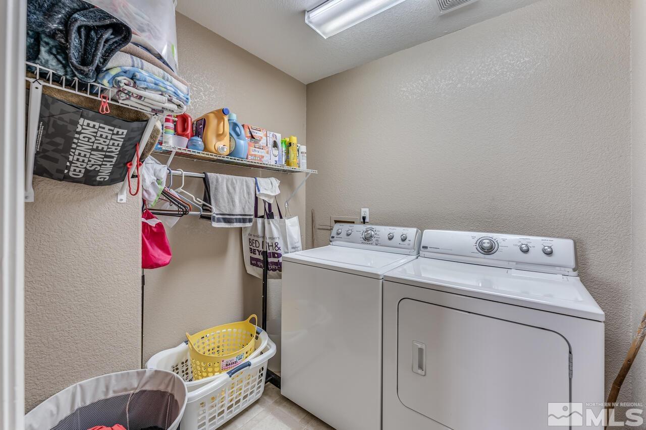 7699 Corso Street Reno, NV 89506 - Photo 30 of 36 a utility room with dryer and washer