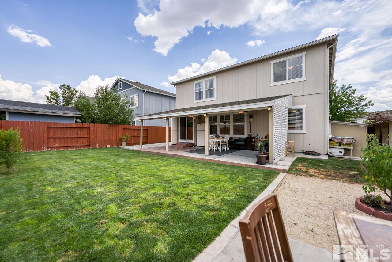 7699 Corso Street Reno, NV 89506 - Photo 33 of 36 a view of a house with backyard porch and sitting area
