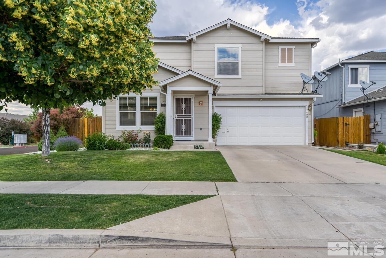 7699 Corso Street Reno, NV 89506 - Photo 36 of 36 a front view of a house with a yard and trees