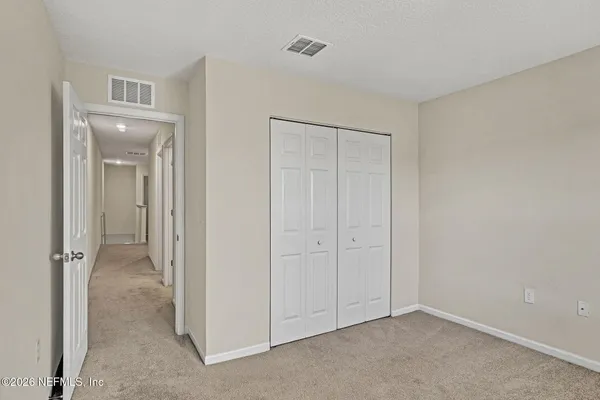 a view of a room that has a glass door and shower