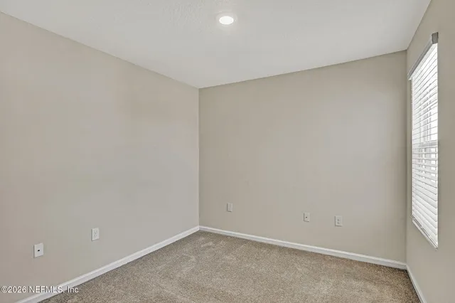 a view of outdoor space with signage and flags