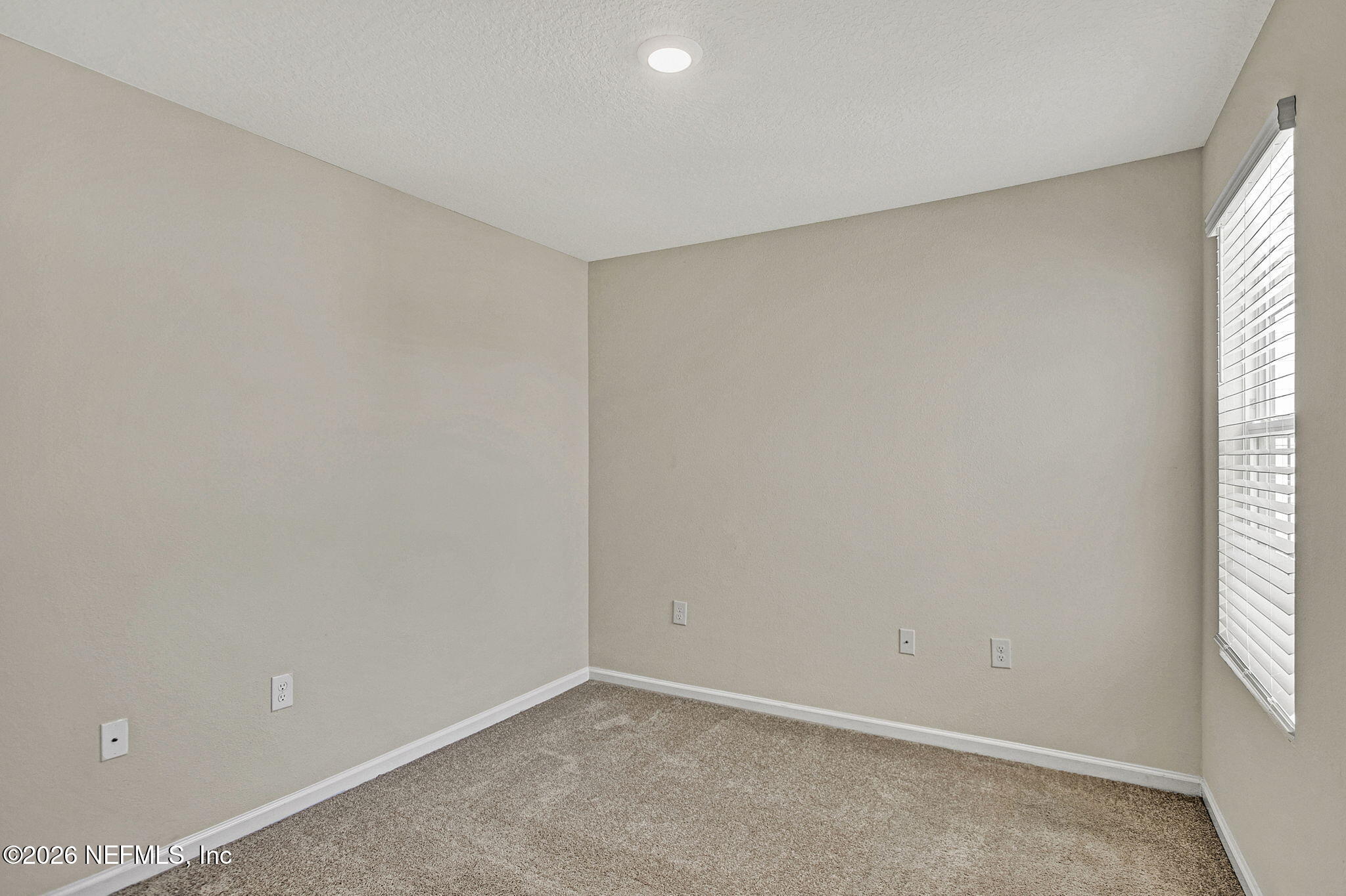 443 Coastline Way Street St. Augustine, FL 32092 - Photo 15 of 29 wooden floor in an empty room with a window