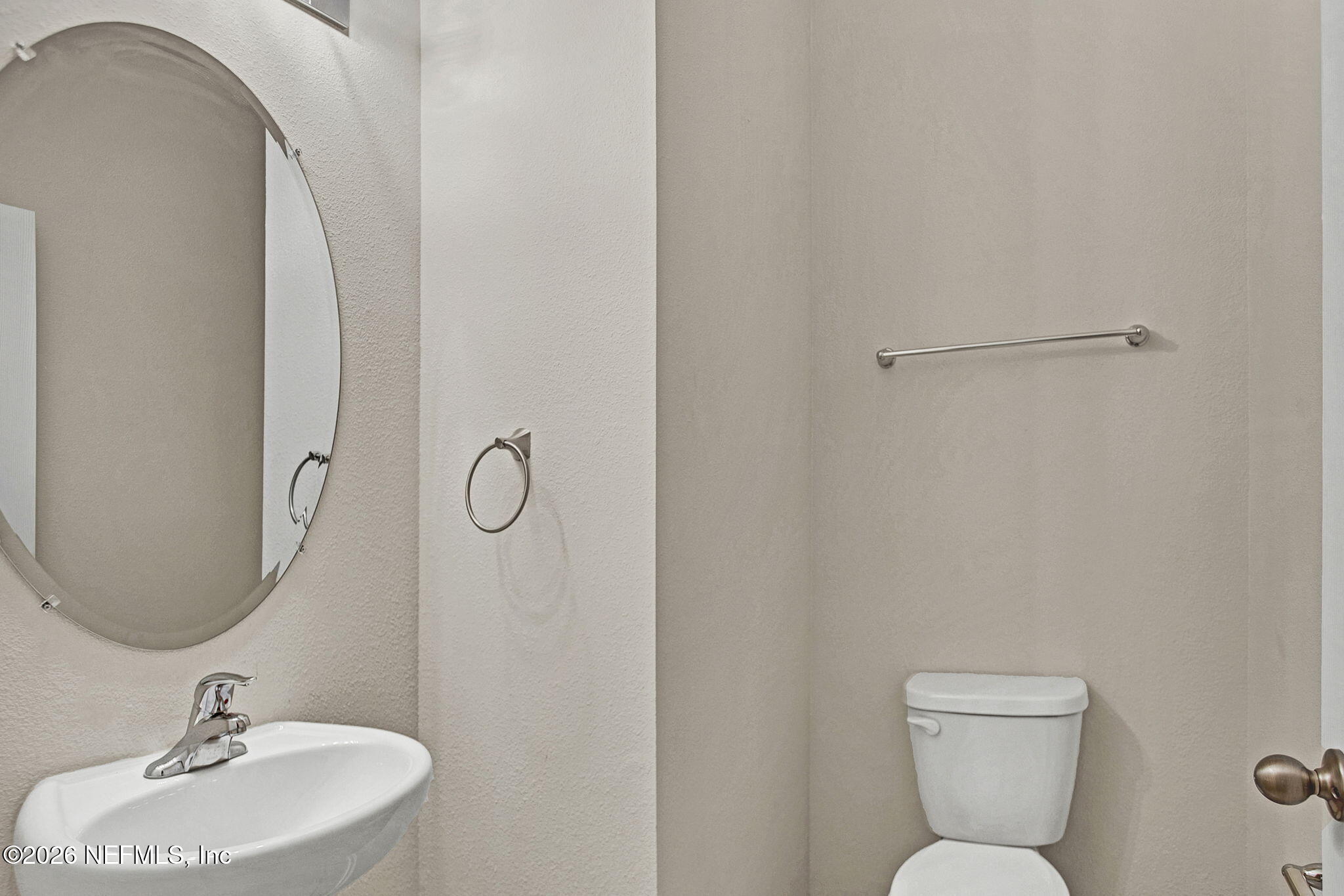 443 Coastline Way Street St. Augustine, FL 32092 - Photo 18 of 29 a bathroom with a toilet sink and mirror