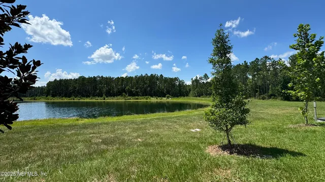 a view of lake with green space