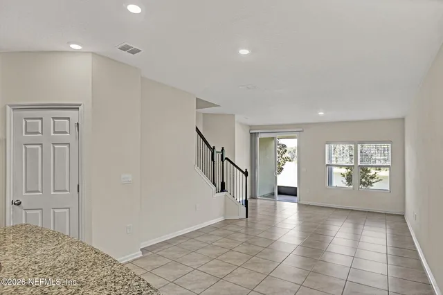 a view of an entryway with wooden floor