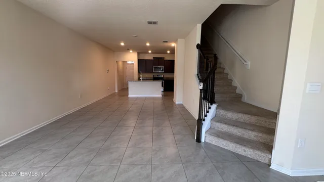 a view of a hallway with a furniture