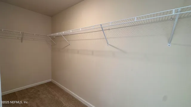 a view of a room with racks on the wall