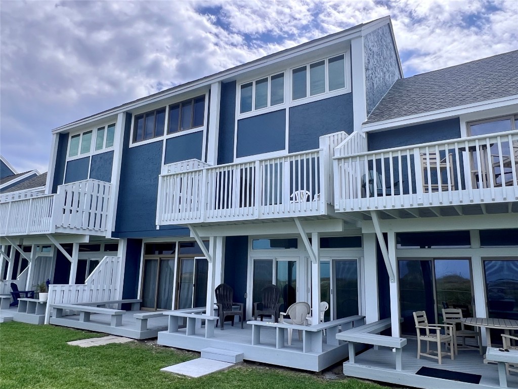 a view of a house with swimming pool and sitting area